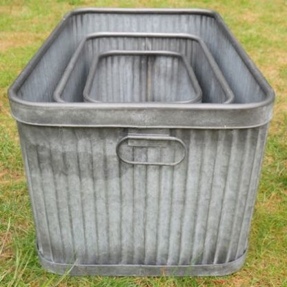 Display your favourite plants in this set of rectangular galvanised tubs. There's three of them. Varying sizes, affordable price, great gift.