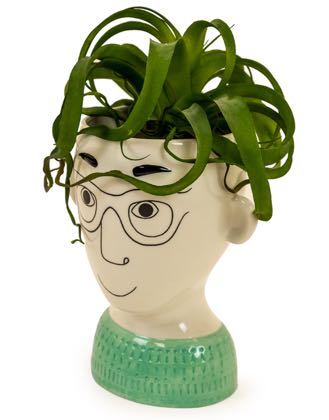 This doodle man face vase, with his stylish specs and an ever positive grin. Will brighten up any room. 30 x 23.5 x 18.2cm. Glossy cream ceramic