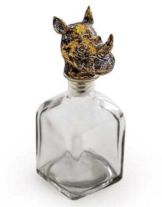 This rhino glass bottle with stopper as a quirky and unusual ornament. The rhino head is an attractive stopper to the square glass bottle. 24 x 10 x 10cm