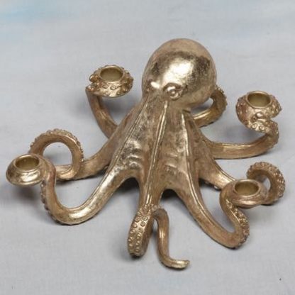 gold octopus candle holder that can hold 4 standard candles. Measures 14 x 28 x 28cm