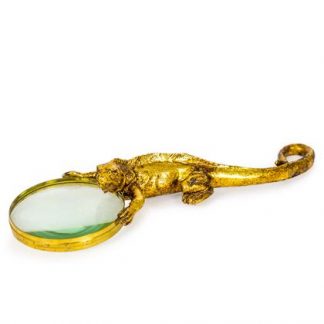 This gold magnifying glass is a lizard! Perfcectly cast in gold painted resin.The lizard handle holds the metal rim. Lightweight and value! 31 x 11 x 5cm