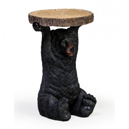 black bear side table has a bear holding a slice of tree trunk above his head that is the surface of the table. Measures 52 x 36 x 36cm