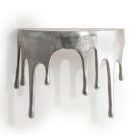 Create a unique space at home with this silver "dali" drip oval shelf. Made of aluminium, nickel colour and great aged finish. 35 x 26 x 16cm