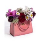 Add a glamorous vibe to your home with this light pink handbag vase. Made of ceramic, super glossy finish 16 x 14 x 24cm. Works as a utensil holder too!