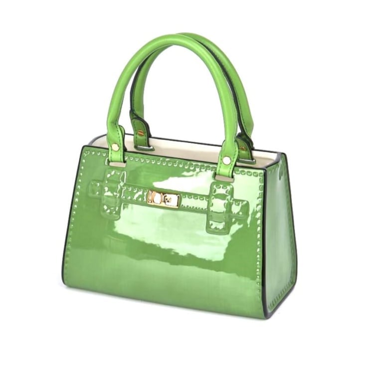 Add a glamorous vibe to your home with this green handbag vase. Made of ceramic, super glossy finish 16 x 14 x 24cm. Works as a utensil holder too!