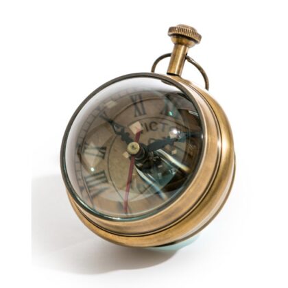 Get a flavour of times gone by with this antiqued brass magnified table clock. The classic ball clock. Paperweight too! Winds up - no batteries. 9 x 9 x 9cm