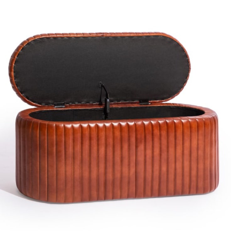 Store anything and everything in this super stylish industrial ribbed leather storage trunk. 93 x 40 x 36cm . With a padded lid so doubles as a seat too!